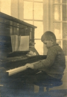 6-year-old Tadeusz Baird at the piano